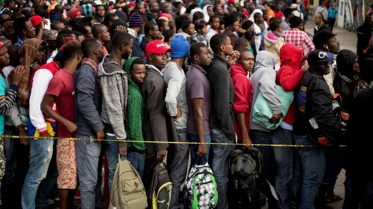 Haitian migrants waiting in a Tijuana, Mexico line. | GUILLERMO ARIAS/AFP/Getty Images