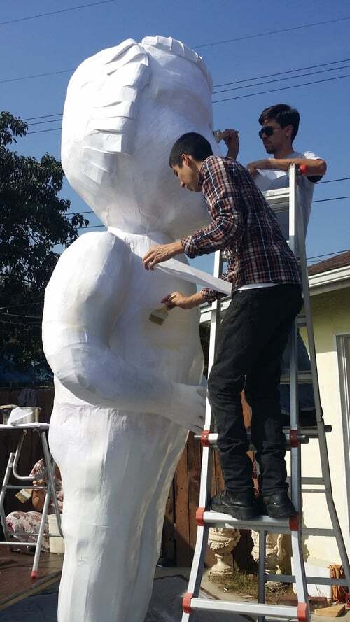 Piñata Design Studio working on a large-scale piñata for Pablo Delgado's "On Their Level" exhibition at Howard Griffin Gallery | Courtesy of Piñata Design Studio