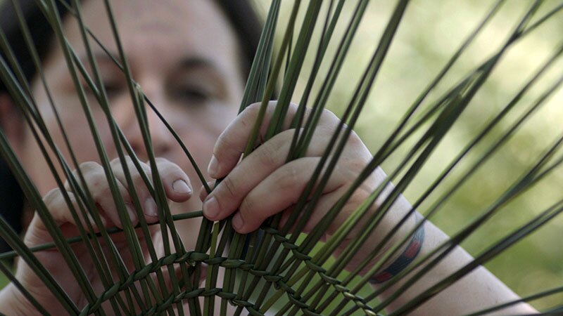 Tima Weaving a Basket