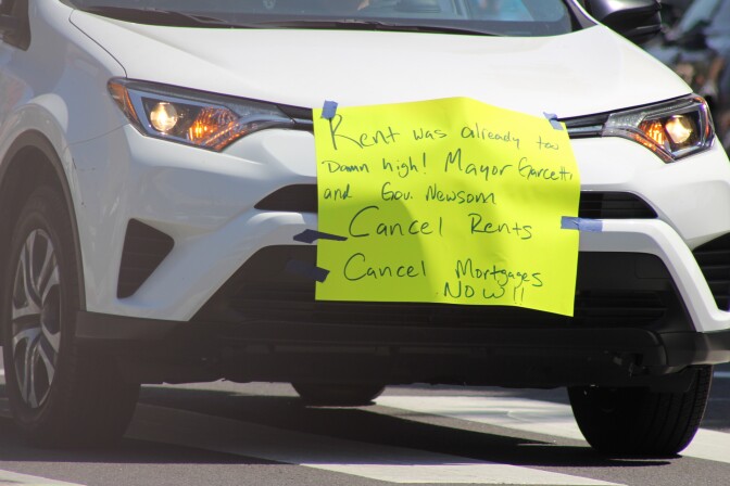 Sign reading "Rent was already too damn high! Mayor Garcetti Gavin Newsom cancel rents, cancel mortgages now" | Karen Foshay