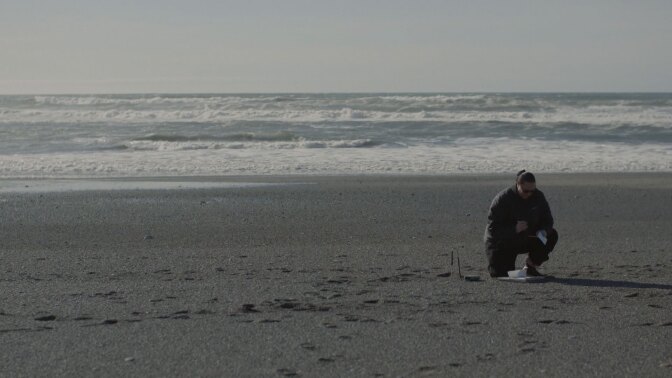 Rosa Laucci, a tribal marine biologist, collects data to monitor for smelt presence on the beach. | Still from "Tending Nature"