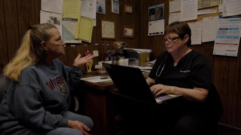 Dr. Kinsell Meets with a Patient