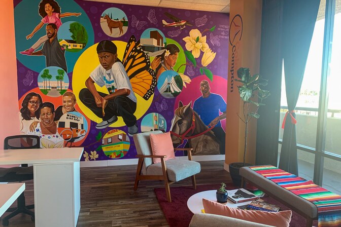 A decorated wall is featured in the interior of Color Compton. | Courtesy of Color Compton