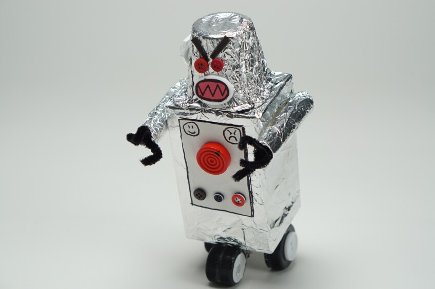 a robot craft made out of boxes covered in aluminum foil decorated with paper decorations and buttons