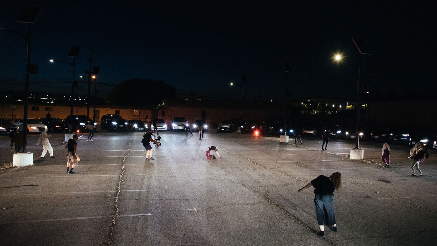 Thirty-five cars formed a circle around dancers in "Parked." | Matthew Brush