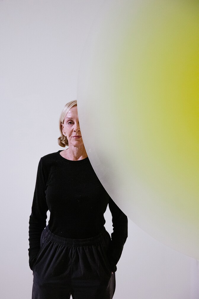 Helen Pashgian behind one of her light and space artworks | Alix Spence
