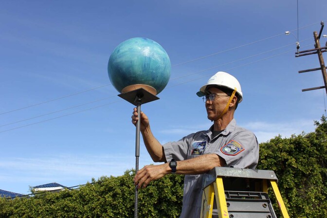 "Solar System Distancing," Rubber balls, inflatable beach balls, acrylic paint, steel rebar, 2020 by Dan Kwong | Courtesy of the artist