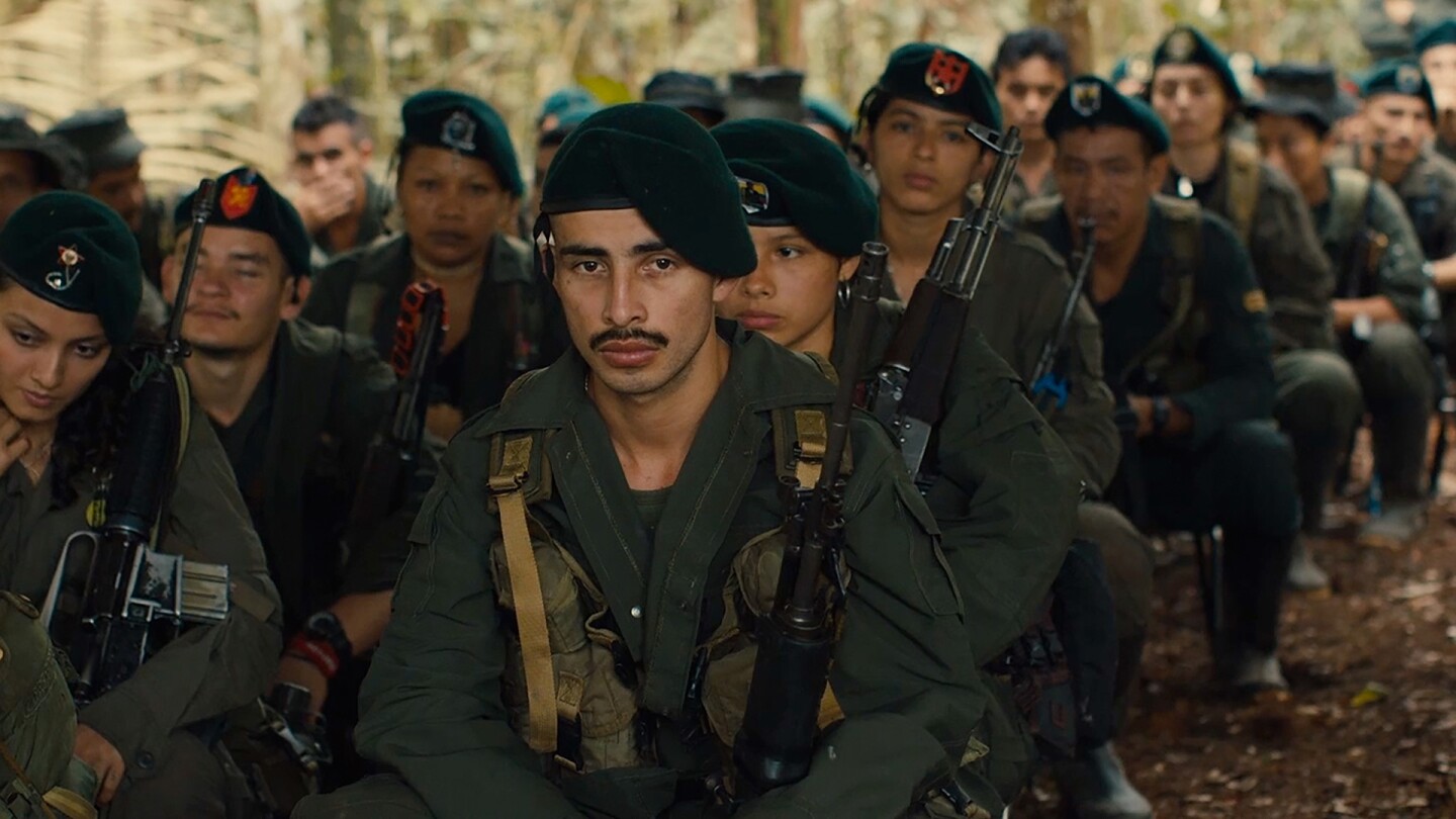 Colombian soldiers sit in many rows. | From "To End a War"