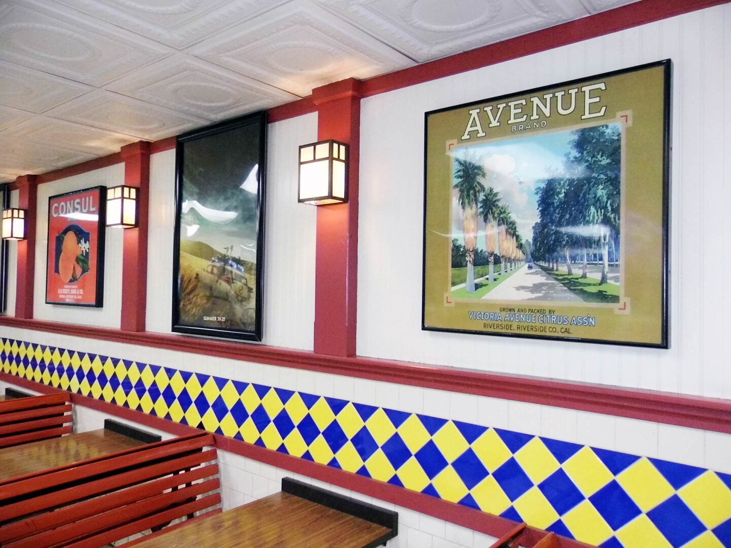 Historic black-and-white photos and reproductions of vintage citrus labels line the walls inside the breeze-blocked snack bar at the Van Buren Drive-In Theatre | Sandi Hemmerlein