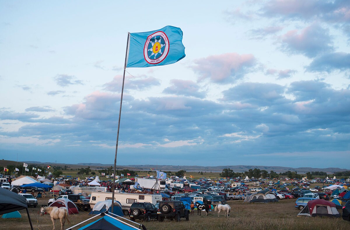A Standing Rock Sioux flag flies over a protest encampment near Cannon Ball, North Dakota where members of the Standing Rock Sioux tribe and their supporters gathered to voice their opposition to the Dakota Access oil Pipeline (DAPL), September 3, 2016.