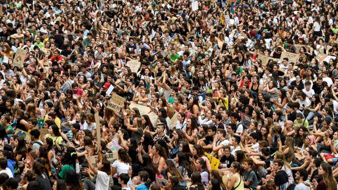Demonstrators take part in a global youth climate action strike on the Placa Sant Jaume in Barcelona, on September 27, 2019. | JOSEP LAGO/AFP via Getty Image