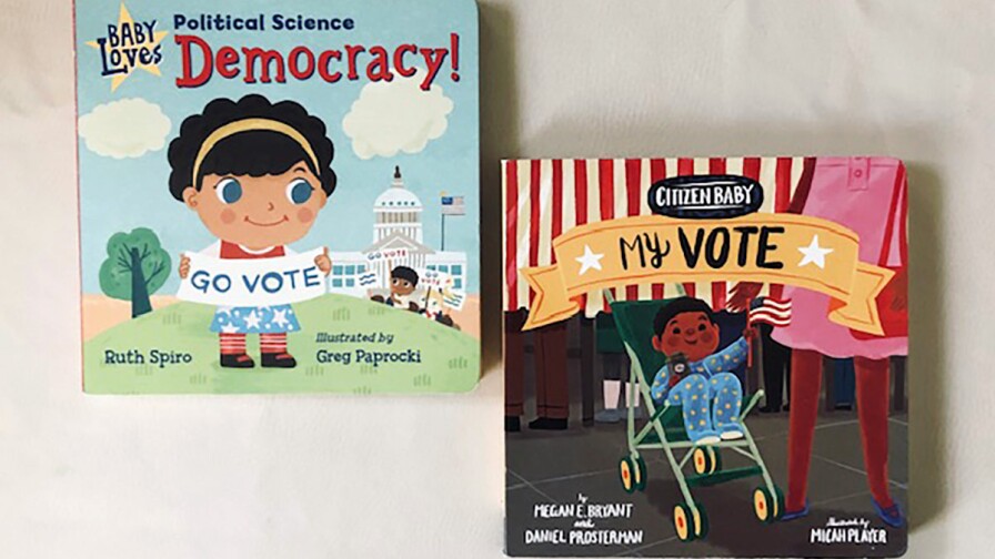 Book covers of “Baby Loves Political Science: Democracy!” featuring a small child cartoon holding a sign that reads "go vote" and of “Citizen Baby: My Vote” featuring a cartoon baby in a stroller.