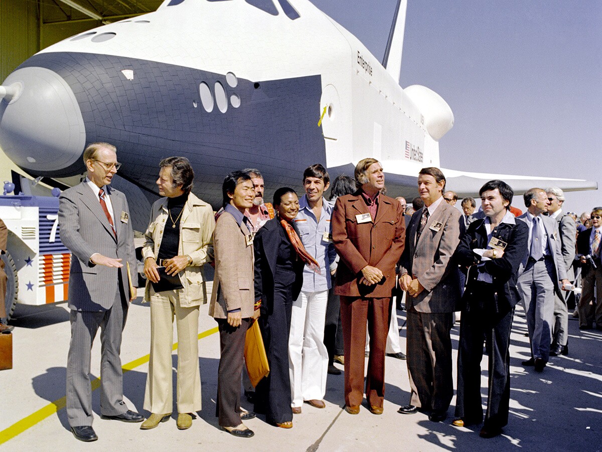 Star Trek creator Gene Roddenberry, the Star Trek cast (with the exception of William Shatner) and NASA administrators attending Enterprise's rollout ceremony in 1976. | NASA/Wikimedia Commons