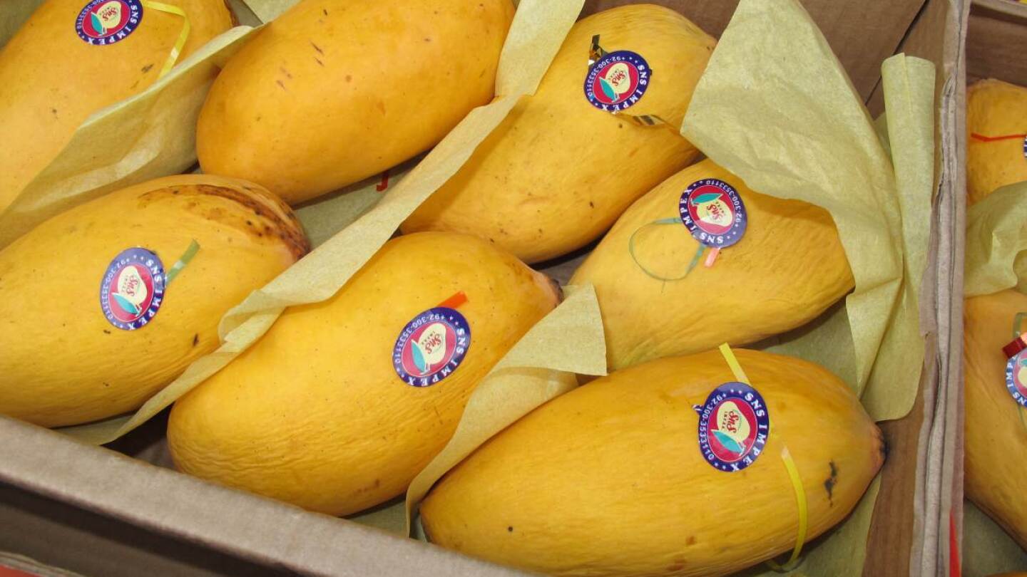 A box of honey mangoes grown in Pakistan on display for sale in the Tooting neighborhood of London, June 15, 2020. | Thomson Reuters Foundation/Laurie Goering