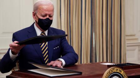 Biden tackles pandemic's devastating impact on the economy