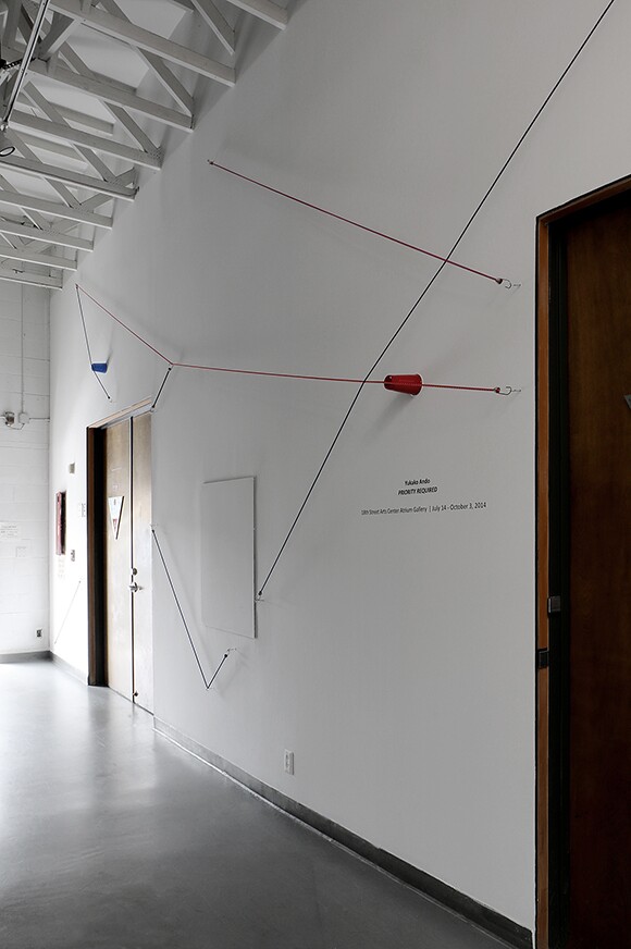 "Picnic," 2014. Bungee cords, plastic cups, and hardware. Installed dimensions variable. "Priority Required," installation at 18th Street Arts Center Atrium Gallery, 2014. | Courtesy 18th Street Arts Center