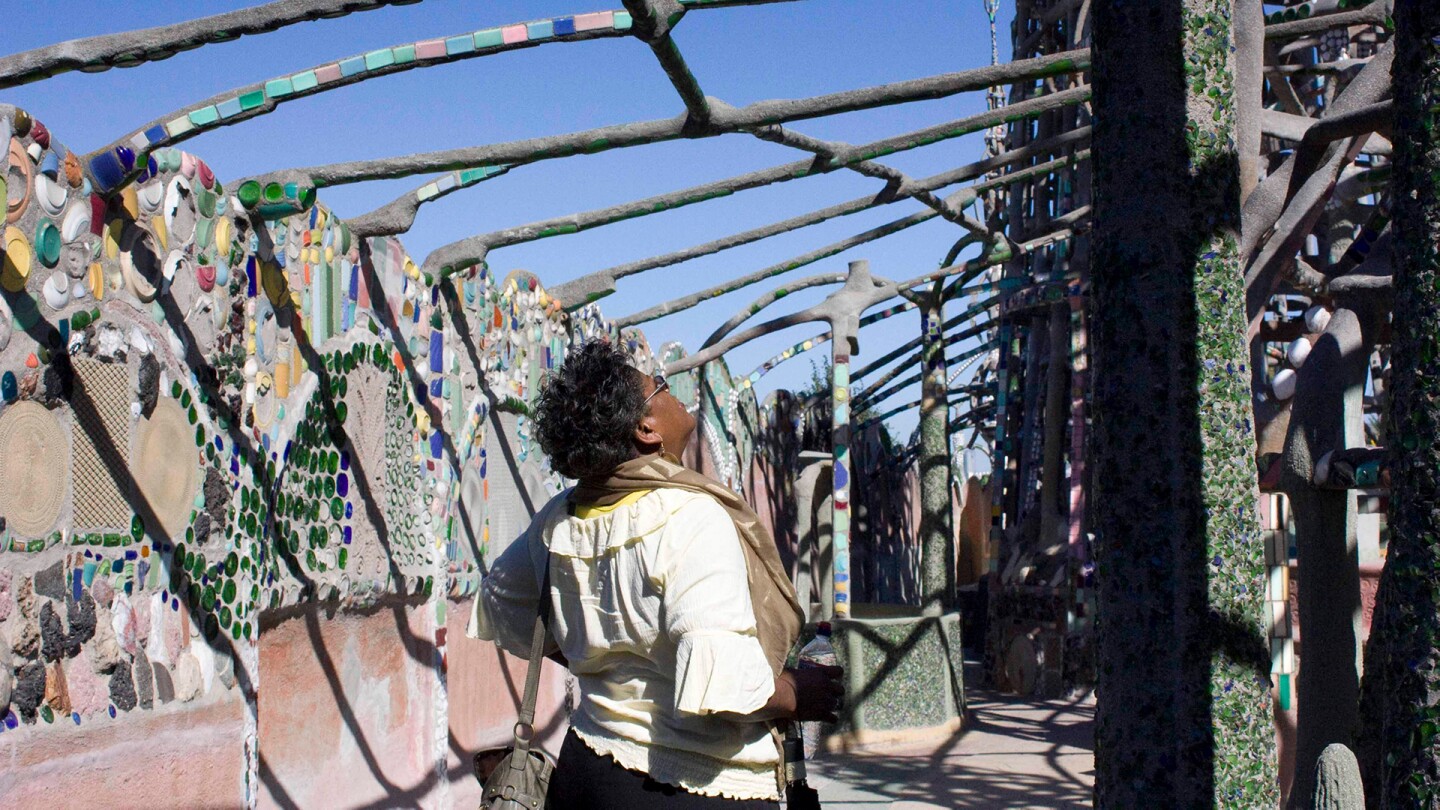 A woman looks up to appreciate the Watts Towers, circa 2011 | Carren Jao