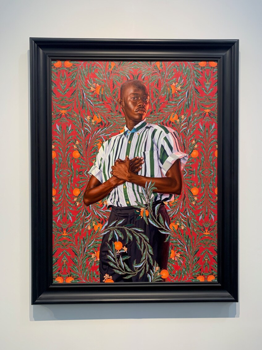 A painting of an African American man with flowers in the background.