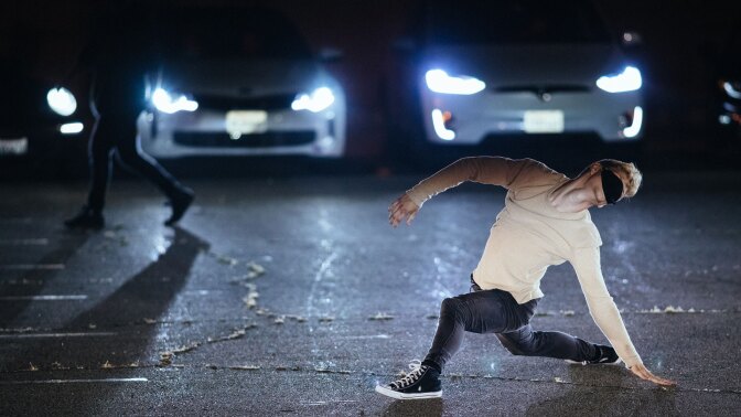 A dancer performs on the pavement of the Santa Monica Airport. | Matthew Brush