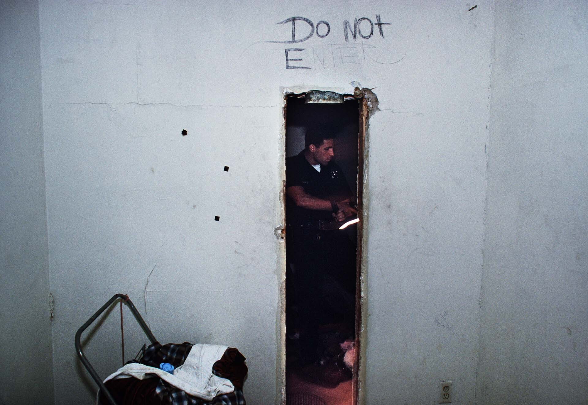 Pacific Division officers on patrol in Venice Beach inspect an abandoned house looking for squatters and drugs. | Joseph Rodriguez