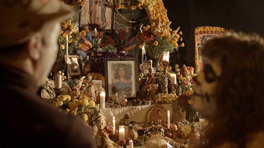 Joseph Leahy in calavera and an altar in the background during Dia delos Muertos | Still from "Artbound" Dia delos Muertos / Day of the Dead