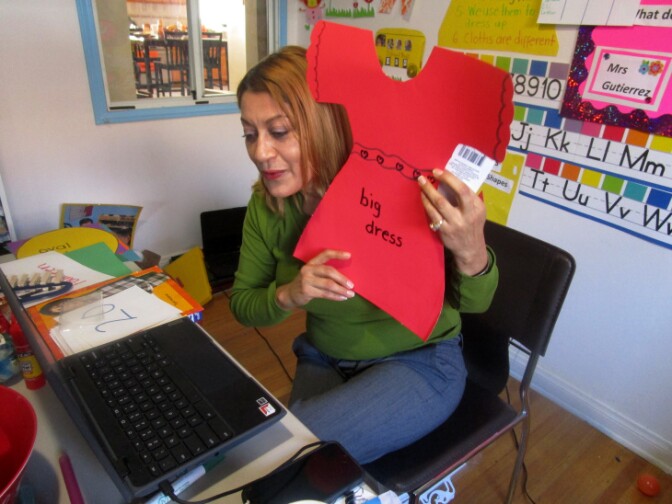 Maria Gutierrez teaching LAUSD preschoolers from the virtual classroom she's created in her home.