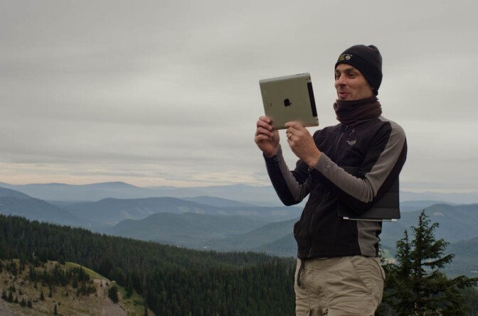 Parks and Technology hiker with ipad