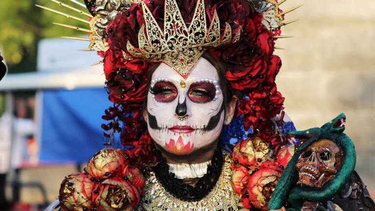 Woman in calavera face paint during Día de los Muertos | Photo from "Día de los Muertos/Day of the Dead" ABs10 