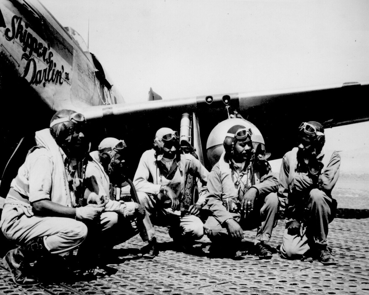 Lt. Dempsey W. Morgan Jr., Lt. Carroll S. Woods, Lt. Robert H. Nelson Jr., Capt. Andrew D. Turner and Lt. Clarence P. Lester in the shadow of a P-51 Mustang in Italy. August 1944. | Courtesy of the National Archives
