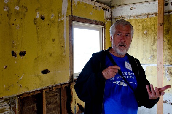 Oceano historian Norm Hammond stands in Gavin Arthur's cabin, the only surviving Dunite structure. | Chris Daly