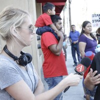 Marie Targonski-O'Brien reporting at a protest in Santa Ana, Calif.