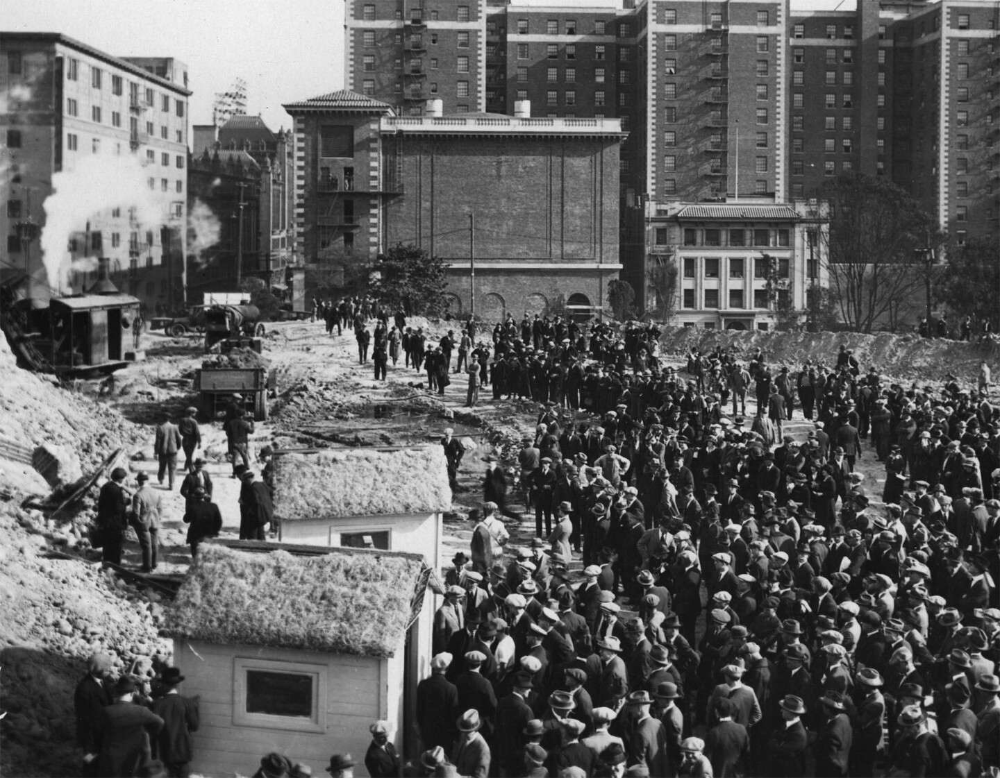 A crowd gathers at the Central Library construction site, circa 1922