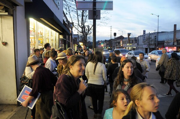 Residents wait for the sign to be lit once again.
