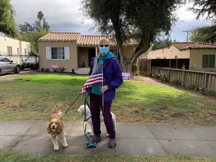 Barbara Wilson walked with the American flag around her Altadena neighborhood after the race was called for Joe Biden. | Josie Huang/LAist