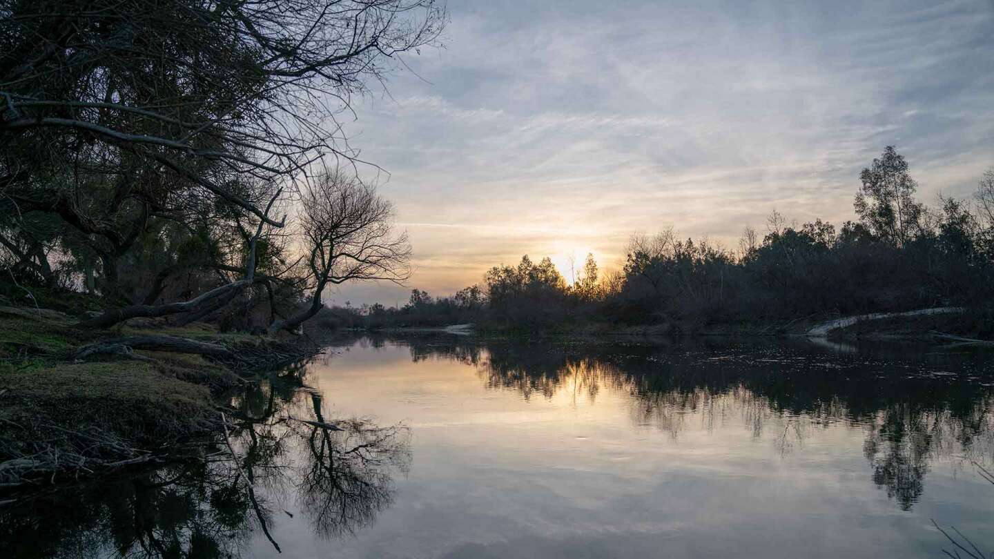 The sun setting on the San Joaquin River. | Carla Pineda
