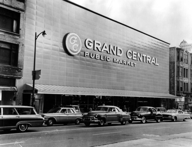 New facade for the 45-year old Grand Central Public Market features 120 ft. long, 3-story high facade, constructed with a porcelain enamel field of blue over columns of granite with stainless steel entrance gates. | Courtesy of Herald-Examiner Collection