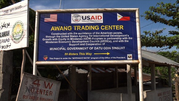 US Aid Sign, Cotabato City | Photo: Courtesy of Sara Schnadt.<br />