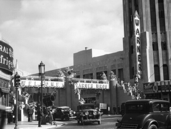 A movie premiere marked the 1931 grand opening of the Wiltern, then named the Warner Western. A temporary footbridge spanned Wilshire Blvd. for the occasion. Courtesy of the Photo Collection - Los Angeles Public Library.