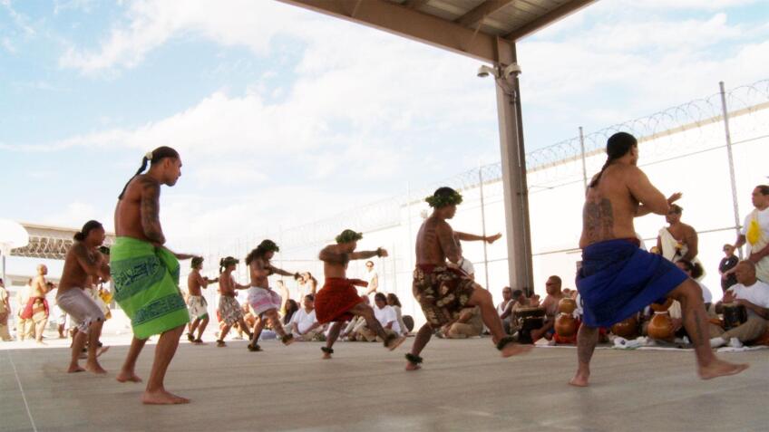 A group of people participate in a traditional indigenous dance. | "Independent Lens: Out of State"