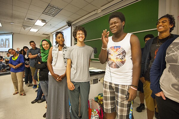 Merima is in green, Michael holding mike, and Will to his right. | Photo: Douglas McCulloh