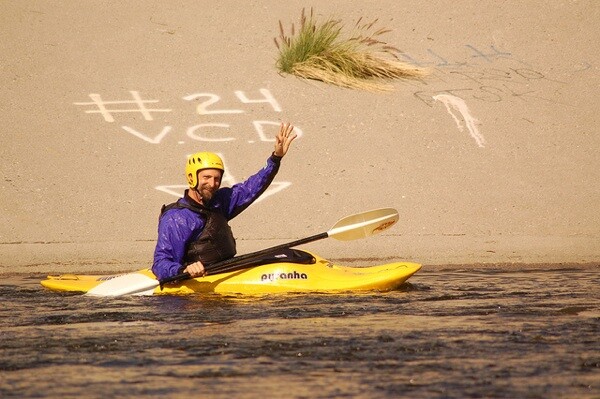 George Wolfe waves from his kayak in the Glendale Narrows in 2009 | Photo by KCET Departures