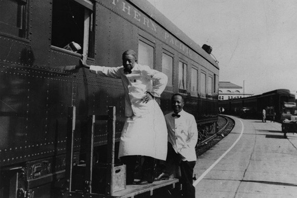 Charles, left, and Frank, waiters for the Southern Pacific Company, seen at the Central Station at 5th Street and Central Avenue in Los Angeles. | Courtesy of the Los Angeles Public Library