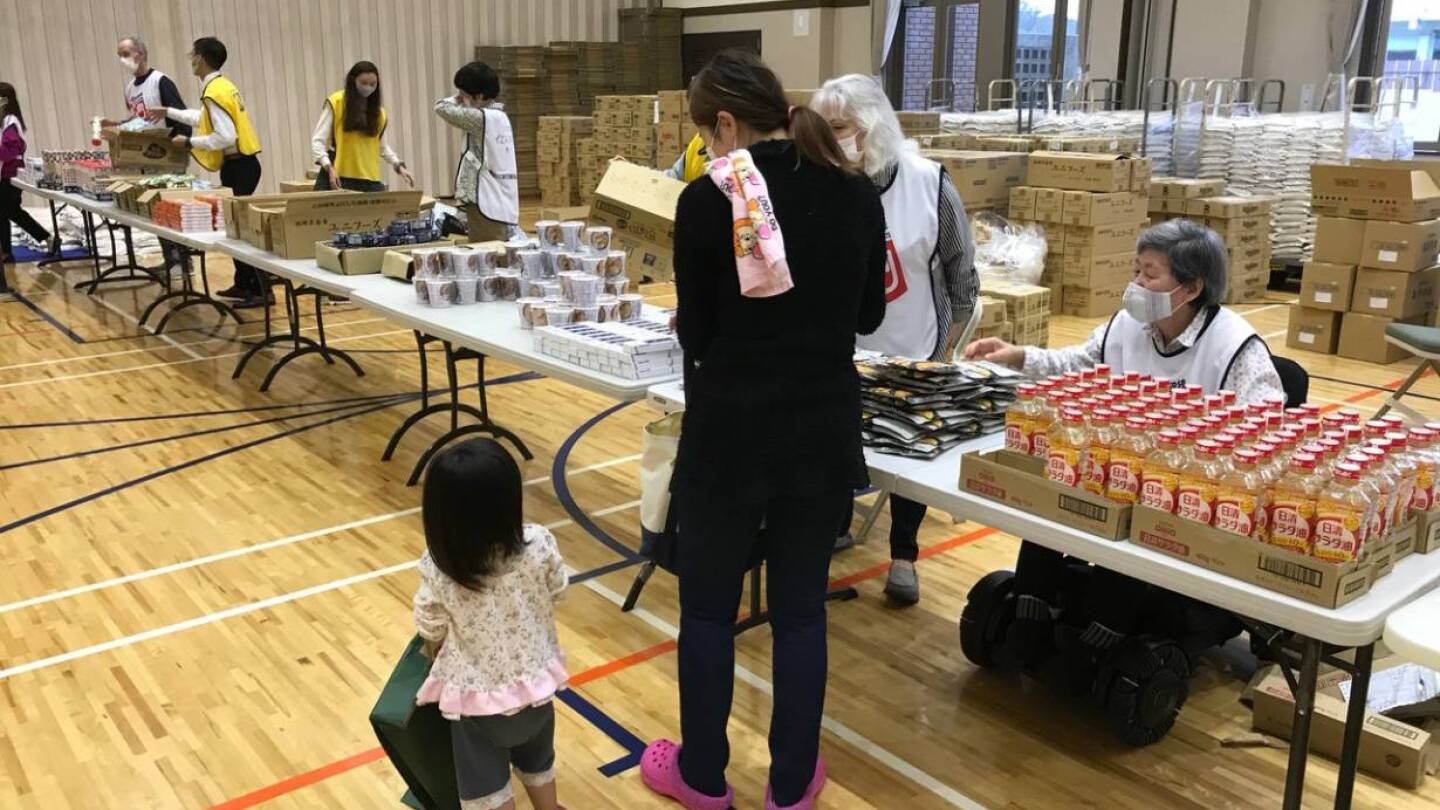 Volunteers handle food donations in Tokyo, Japan