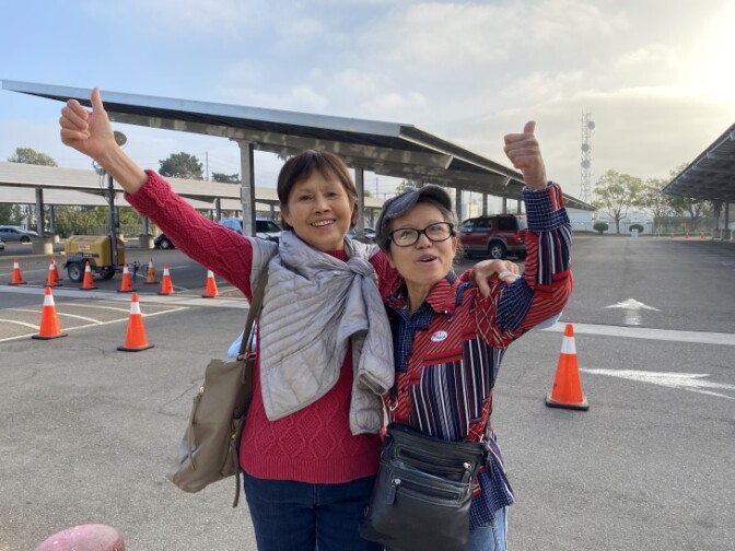 Trinh Luu (left) from Tustin and her sister, Anh Luu (right) from Stanton, arrived at the Orange County Registrar’s office this morning at 6:30 a.m. | Jill Replogle/LAist