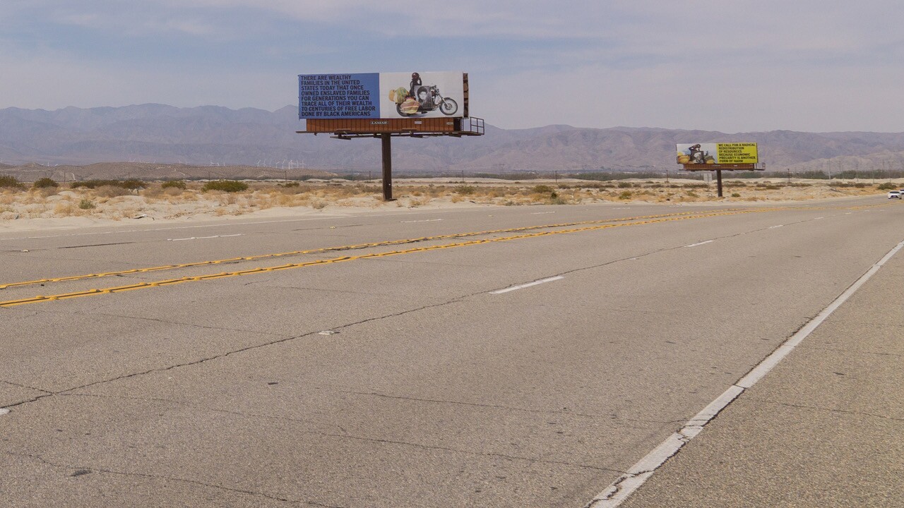 Xaviera Simmons' "Because You Know Ultimately We Will Band A Militia" is a series of billboards along Gene Autry Trail as part of Desert X 2021.