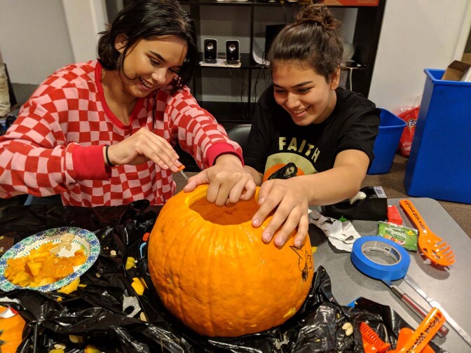 Storytelling and artistic self-expression is also a staple of healing. Californians for Justice leaders at the annual Halloween social carving a pumpkin. | Californians for Justice