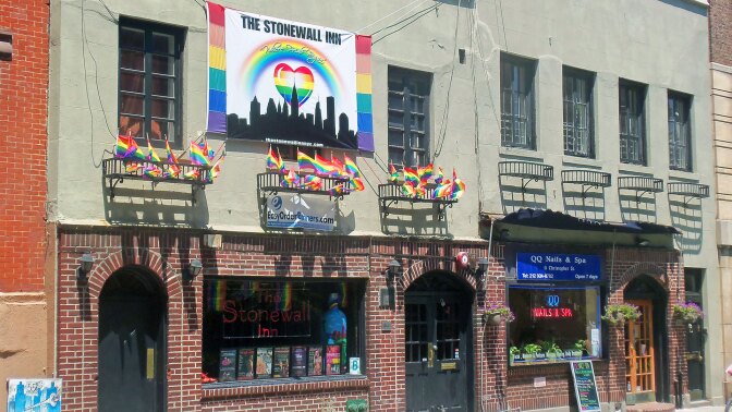 Stonewall Inn, birthplace of the modern gay-rights movement, festooned with gay-pride banners and flags the weekend after Gay Pride Day. | Wikimedia / GNU Free Documentation License