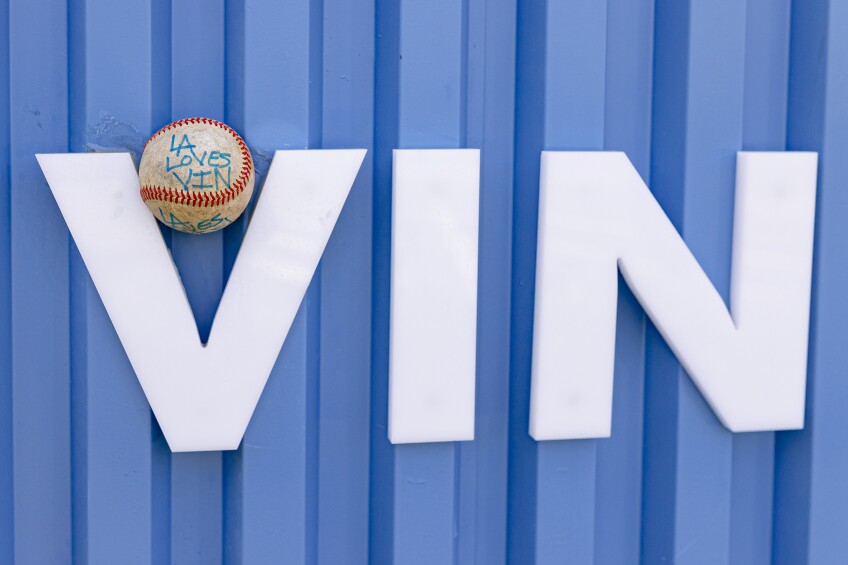 The letters VIN is written in white against a blue background with a baseball that says "L.A. loves Vin." 