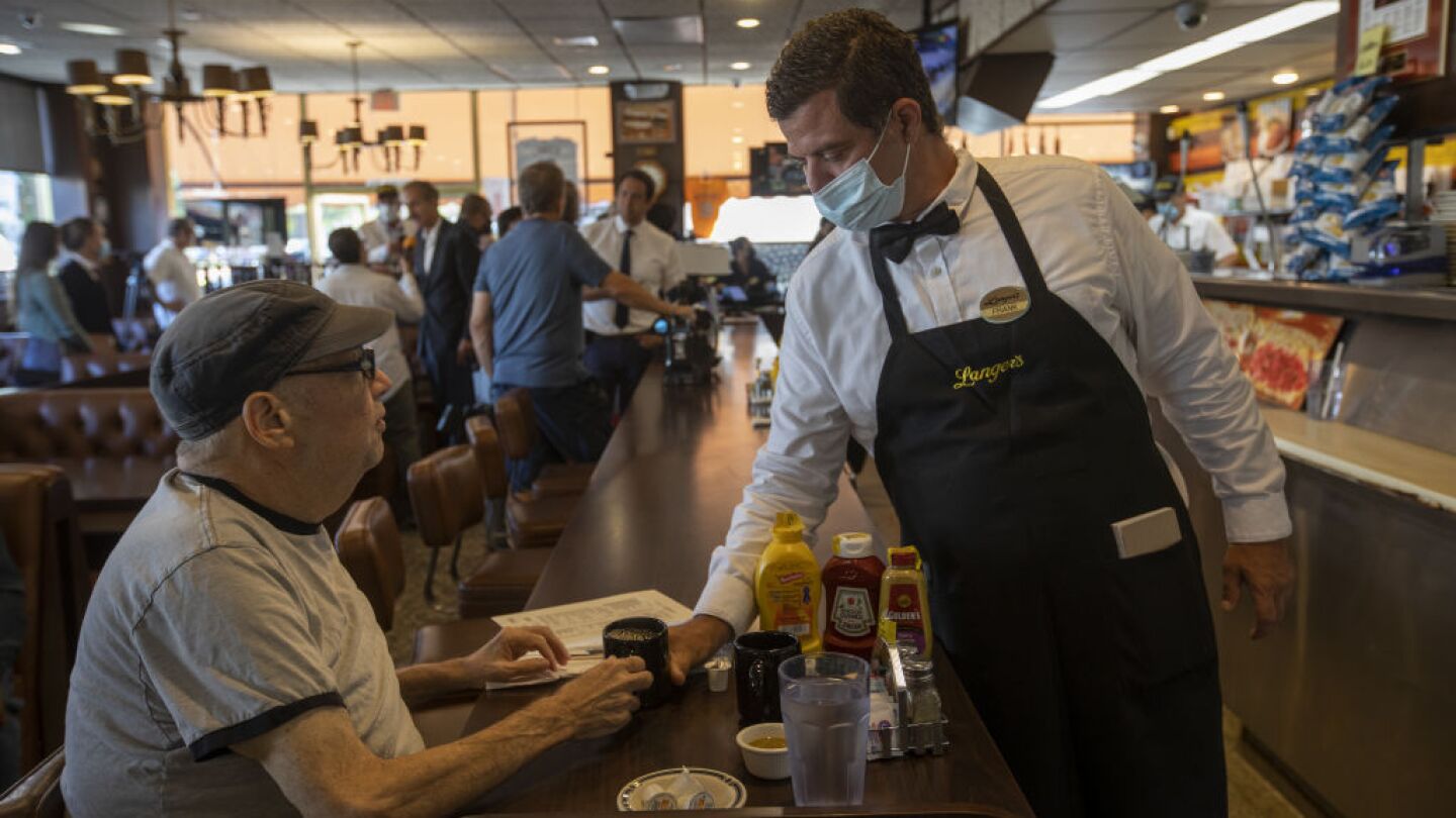 A server waits on a customer at Langer's Deli in Los Angeles, California