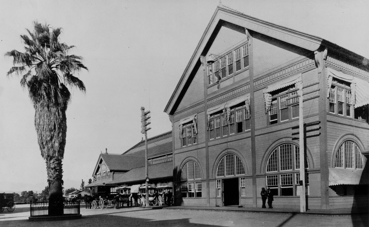A fan palm greeted tourists and emigrants when they arrived at the Southern Pacific's Arcade Station. Circa 1890 photo courtesy of the Los Angeles Examiner Collection, USC Libraries.